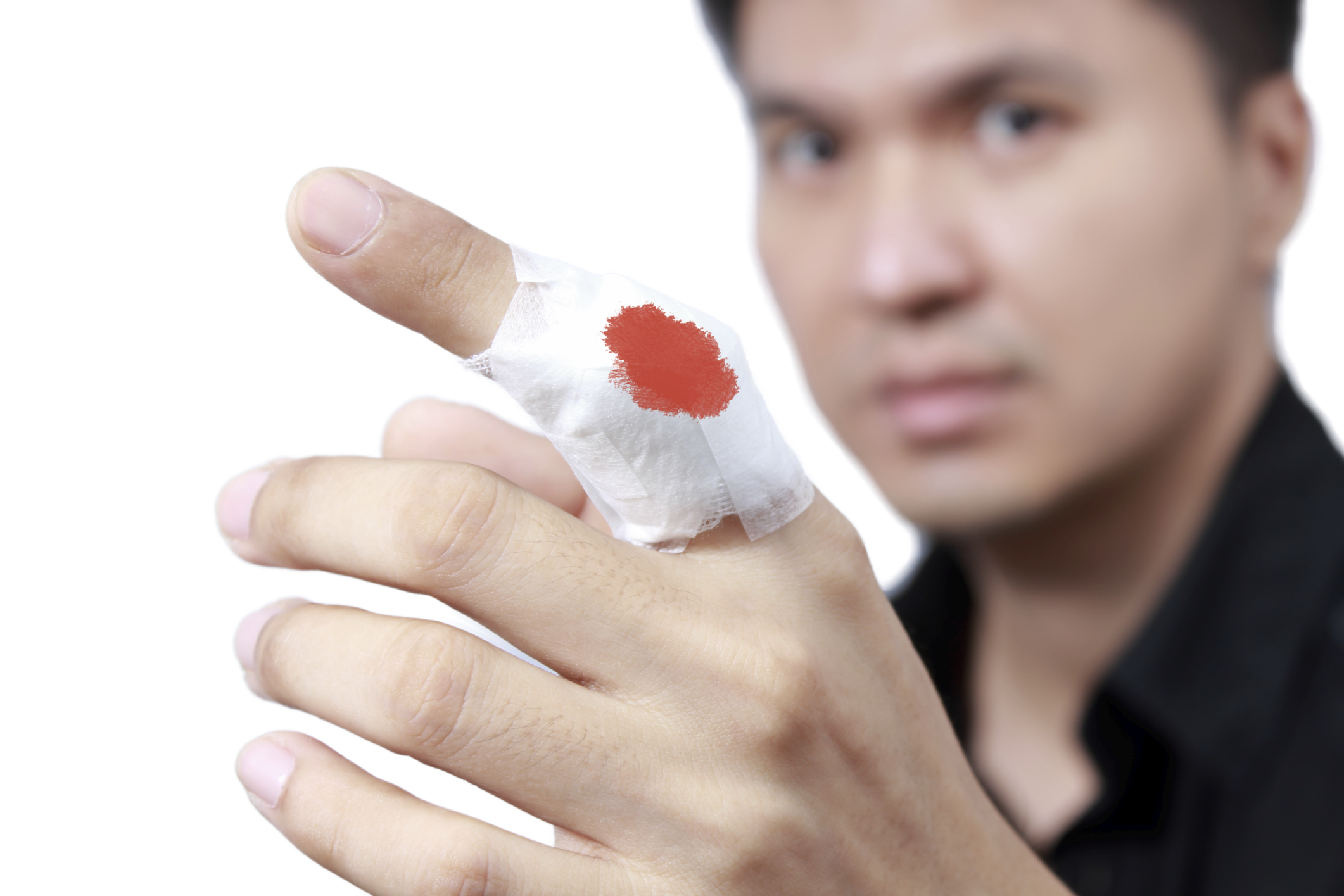Injured painful finger with white gauze bandage, isolated