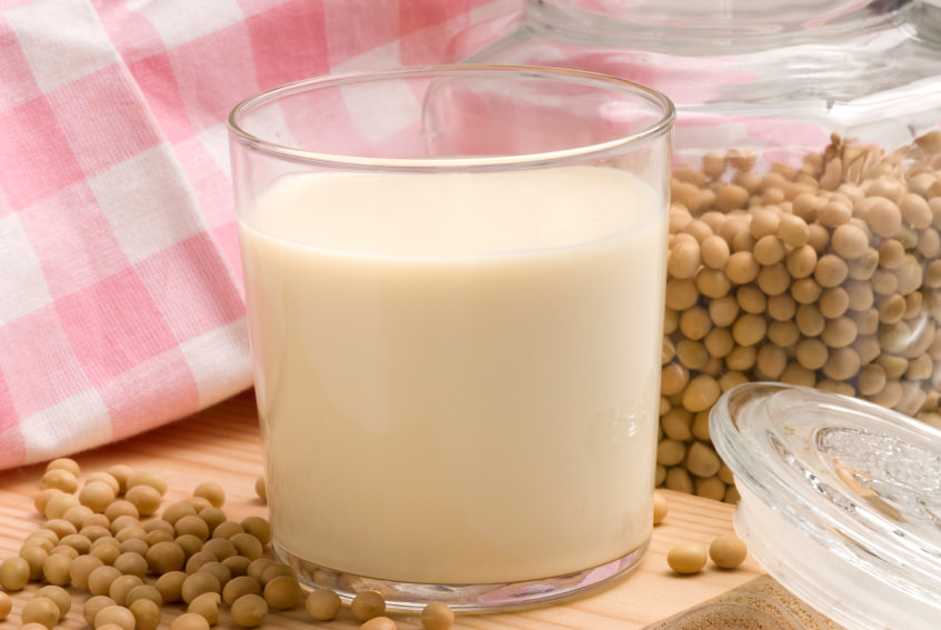 Soybeans and soy milk in a glass. Selective focus.