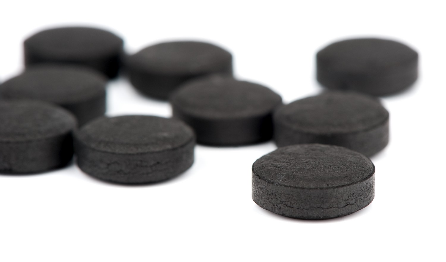 Medical Tablet activated coal isolated on a white